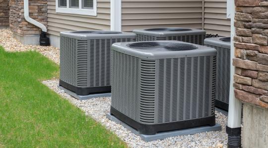 Strong Heating & Cooling HVAC installation beside a Colorado home