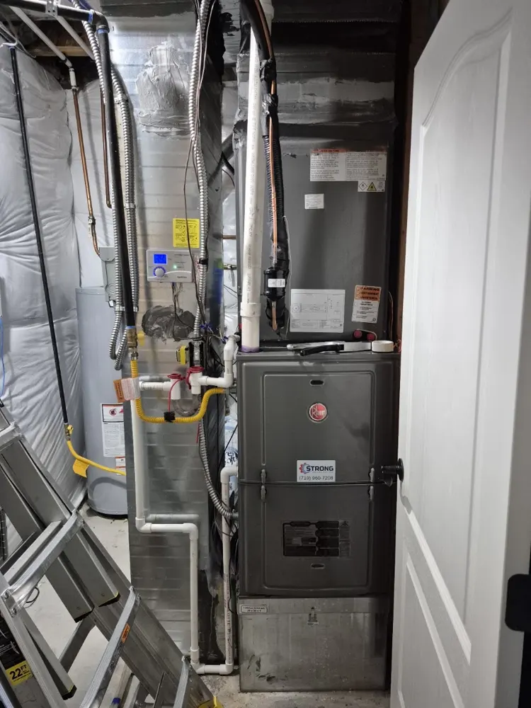 New Rheem gas furnace installed in a closet