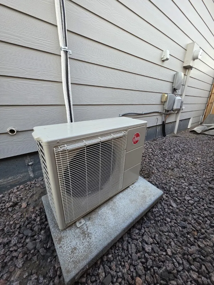 Mini-split condenser on a raised pad