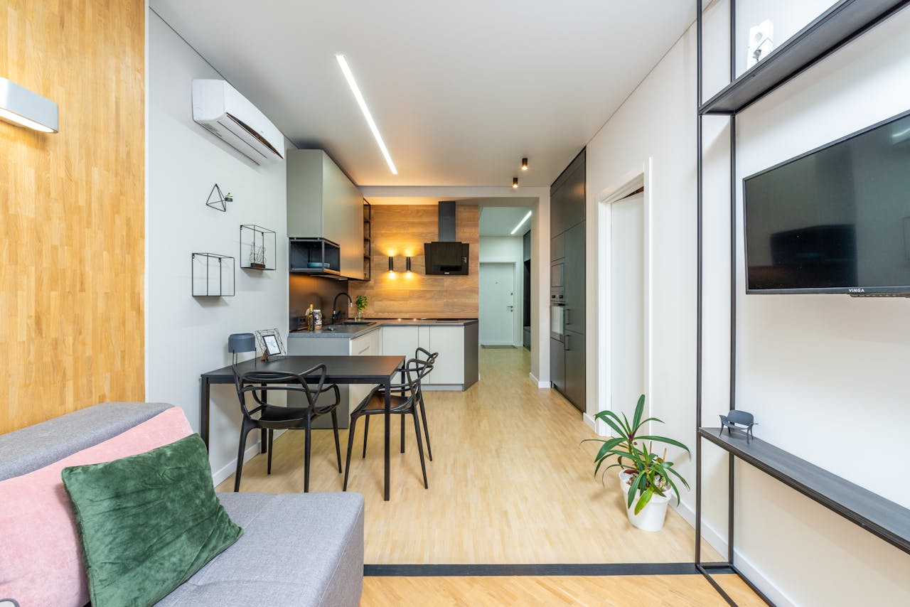 Bright and spacious modern studio apartment featuring open living and kitchen area.